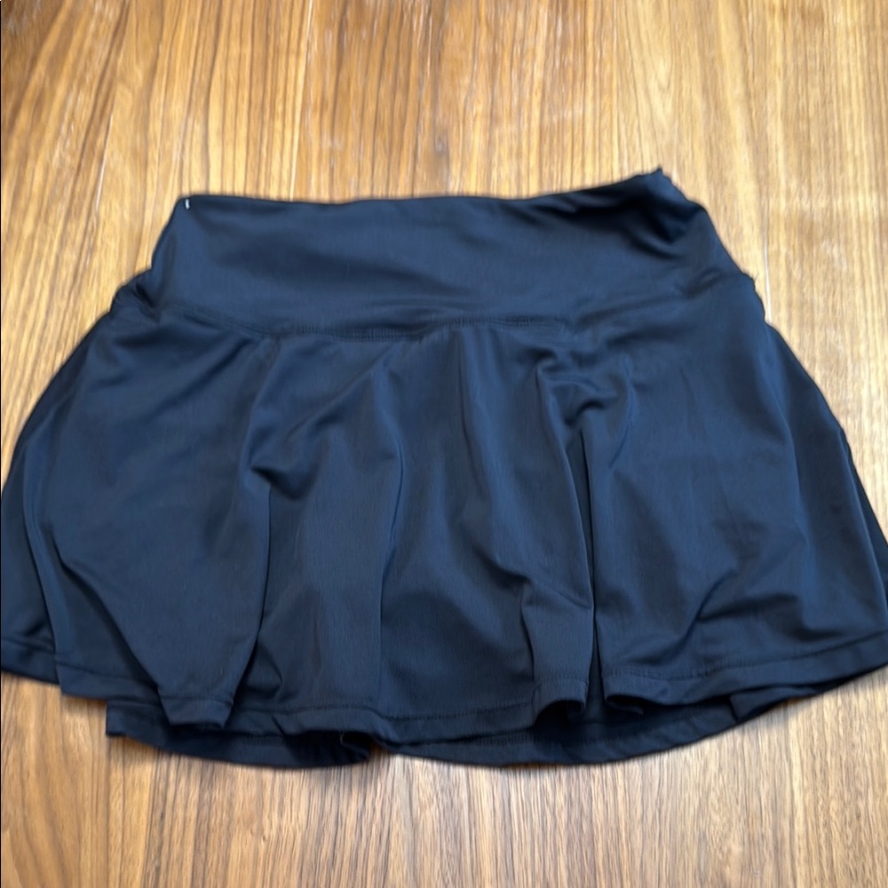 Black Tennis Skort with ball pockets and hidden waistband pocket